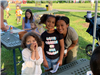 Family in front of picnic table