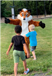 Children in front of fox mascot
