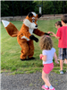 Children in front of fox mascot