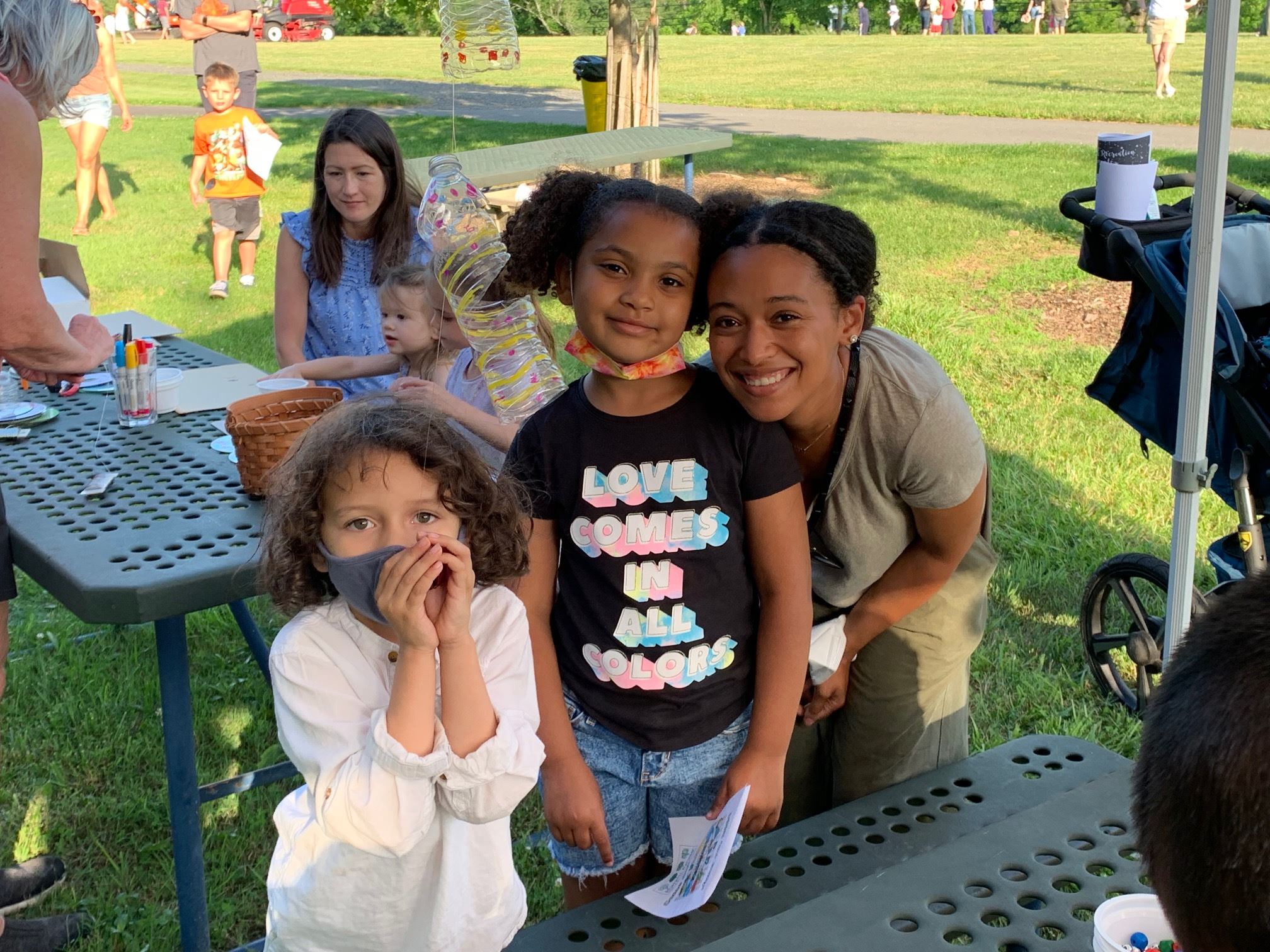 Family in front of picnic table