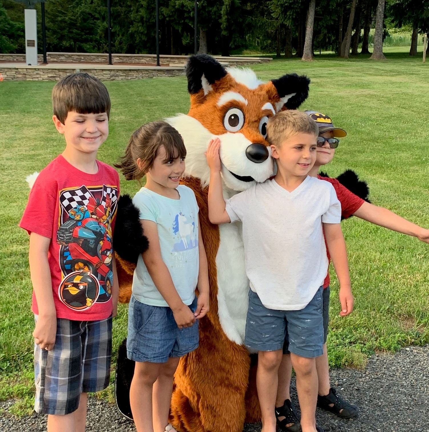 Children in front of fox mascot
