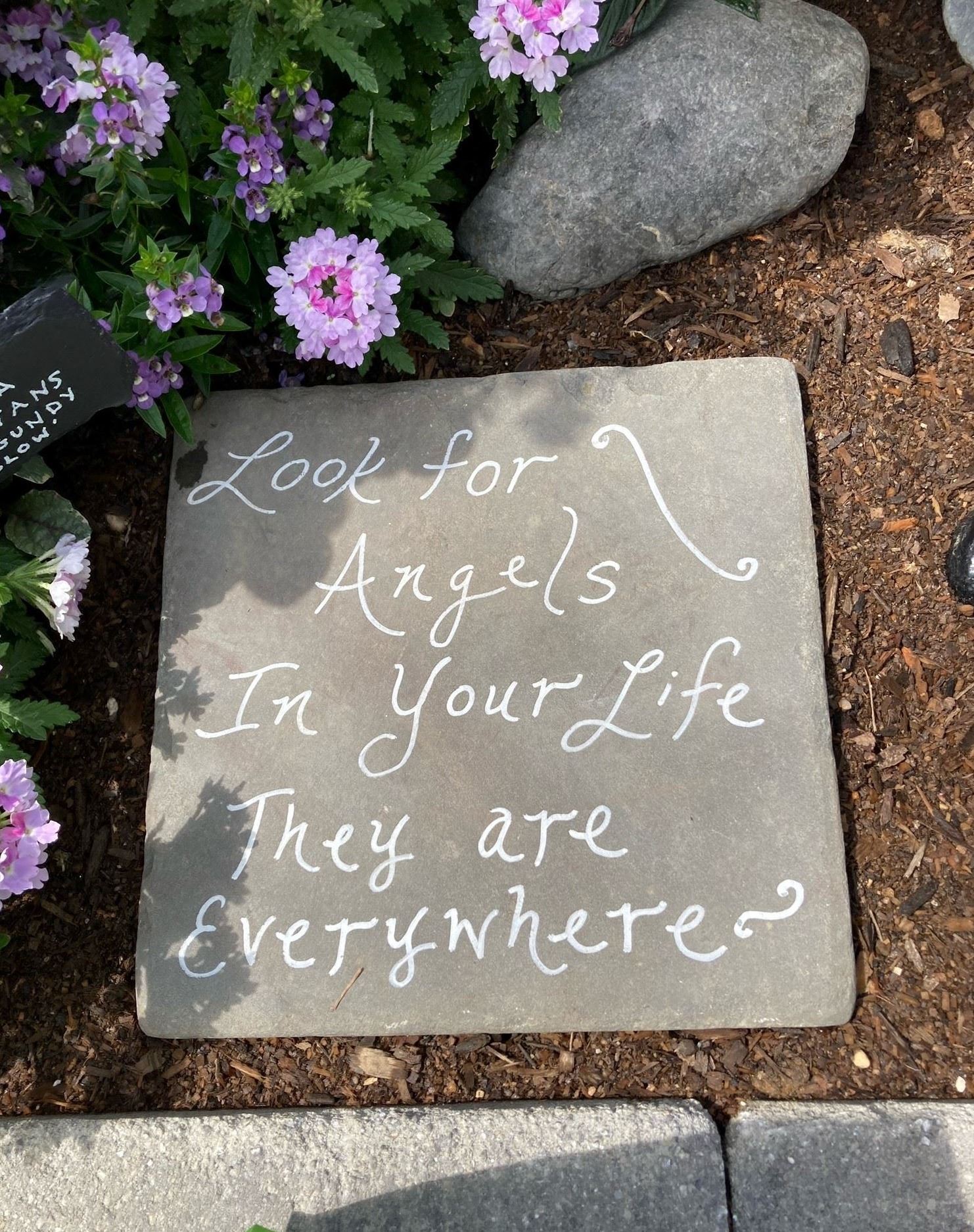 sign on slate saying look for the angels in your life, they are everywhere