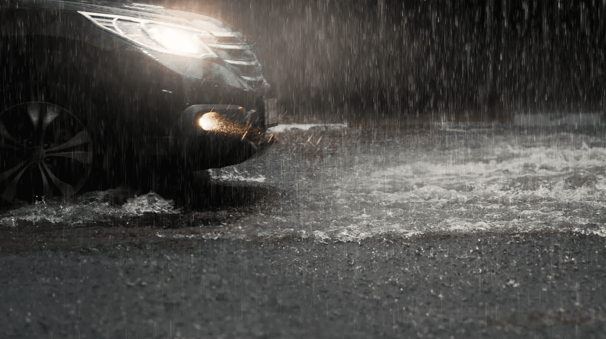 car in heavy rain