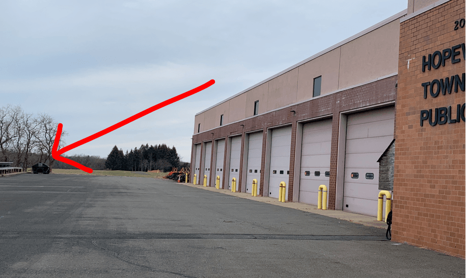 recycling bin in parking lot at public works building